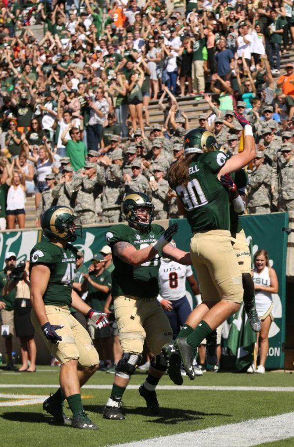 The Rams celebrate a first quarter touchdown during the game against UTSA on Saturday afternoon at Hughes Stadium.
