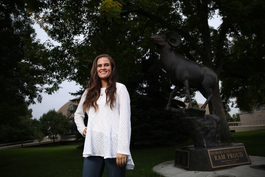 Colorado State University junior Kelly Davis poses for a portrait by the CSU Ram statue on Tuesday afternoon. Davis, who is the Vice President of Active Minds, an organization aimed at reducing mental health stigma among students, recently won a scholarship from the national Active Minds organization. (Forrest Czarnecki | Collegian)
