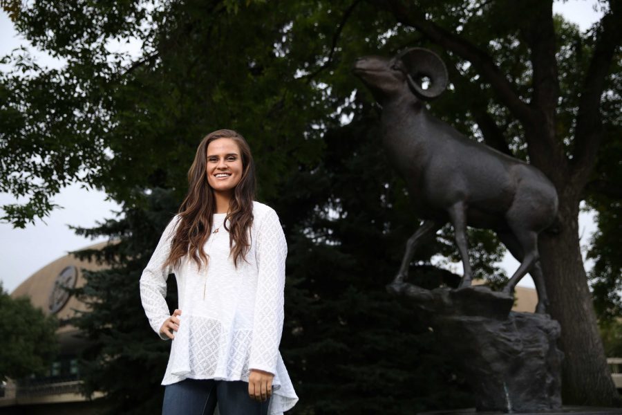 Colorado State University junior Kelly Davis poses for a portrait by the CSU Ram statue on Tuesday afternoon. Davis, who is the Vice President of Active Minds, an organization aimed at reducing mental health stigma among students, recently won a scholarship from the national Active Minds organization. (Forrest Czarnecki | Collegian)