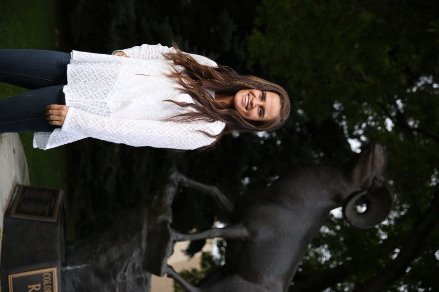 Colorado State University junior Kelly Davis poses for a portrait by the CSU Ram statue on Tuesday afternoon. Davis, who is the Vice President of Active Minds, an organization aimed at reducing mental health stigma among students, recently won a scholarship from the national Active Minds organization. (Forrest Czarnecki | Collegian)