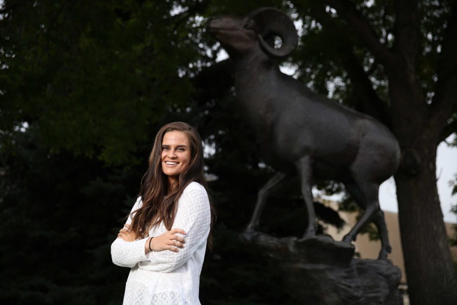 Colorado State University junior Kelly Davis poses for a portrait by the CSU Ram statue on Tuesday afternoon. Davis, who is the Vice President of Active Minds, an organization aimed at reducing mental health stigma among students, recently won a scholarship from the national Active Minds organization. (Forrest Czarnecki | Collegian)