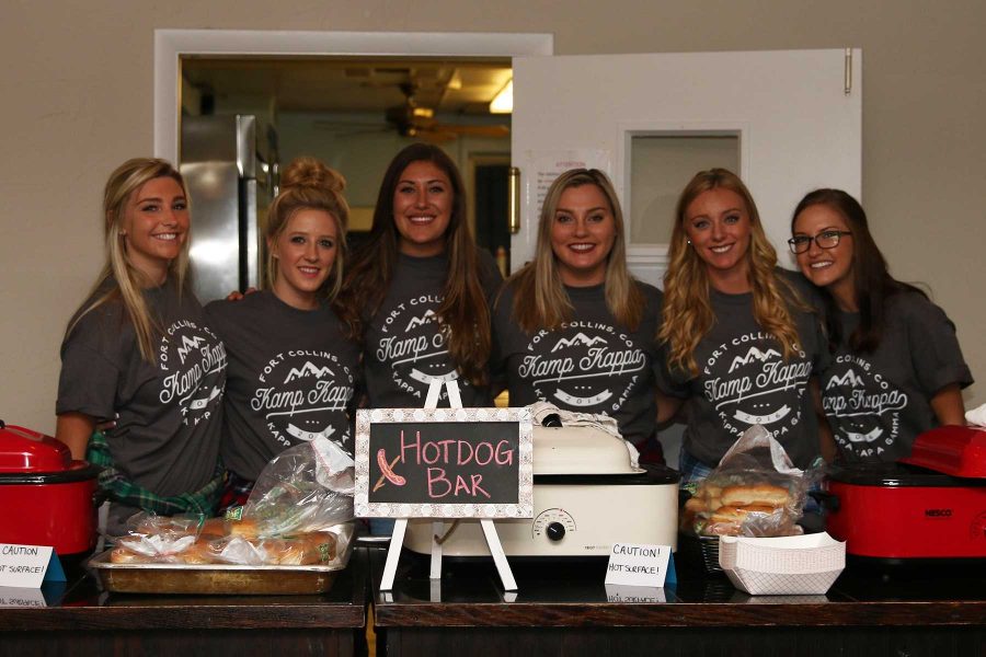 Kappa Kappa Gamma members Bailey Sniffin, Allie Holtschneider, Sabrina Hille, Kelsey Sultzman, Emma Bielefeldt, Dani Smithpeter, and Angie Cromwell work the Hot Dog Bar at Kamp Kappa. (Elliott Jerge | Collegian)