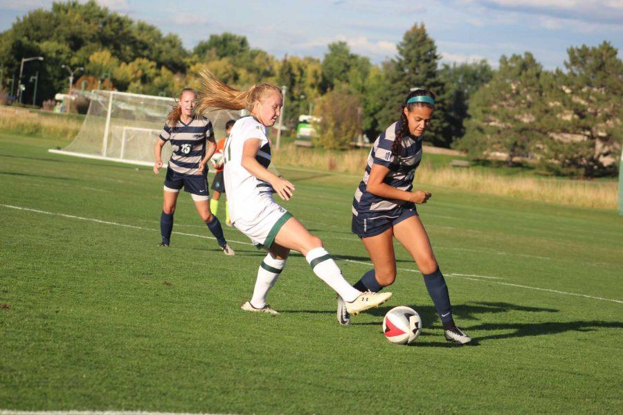 Halley Havlicek (21) steals the ball away from Nevada offense.