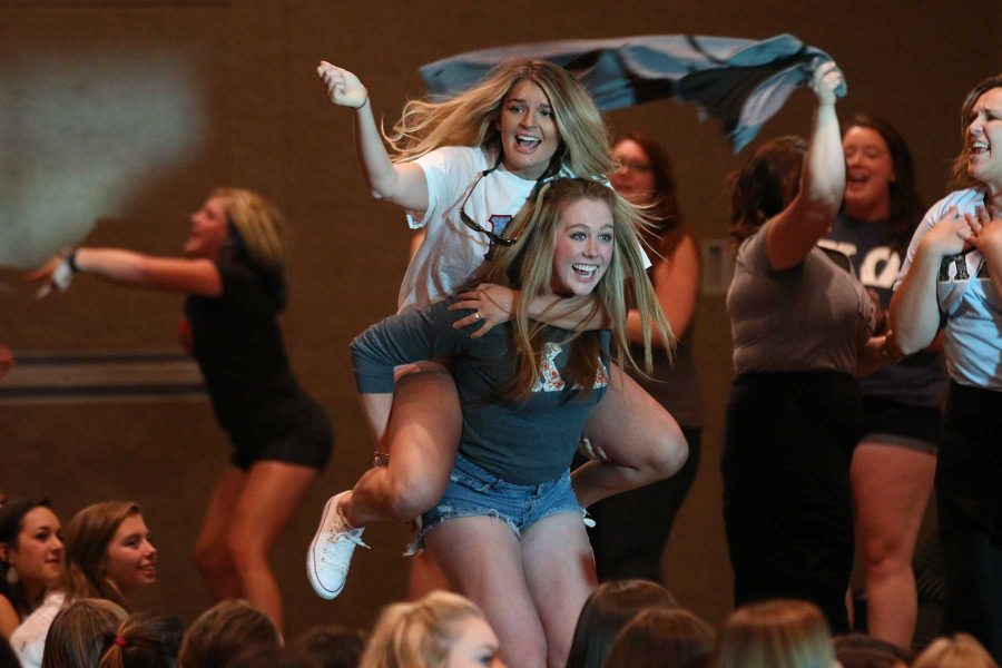 Recruitment Coaches celebrate the revealing of their letters for the first time since school began. (Elliott Jerge | Collegian)