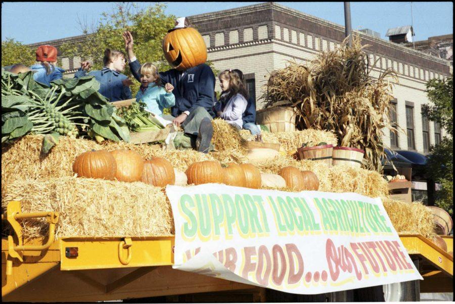 Homecoming float with banner reading Support Local Agriculture, Your Food Our Future from 1984/ Photo credit: University Archives and Special Collections