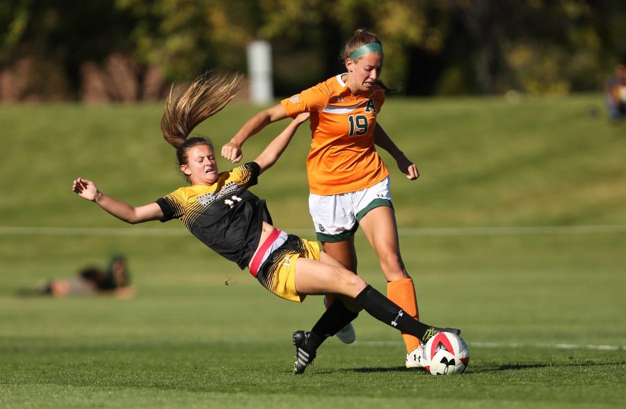 Colorado State University's Kasey Dietrich (19) fights to get past Colorado College's Madeline Stesney (11) during the first half of the game on Friday afternoon at the Lagoon Field. The Rams were beat by the Tigers 2-0. (Forrest Czarnecki | Collegian)