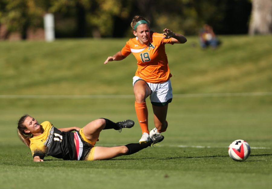 Colorado State University's Kasey Dietrich (19) fights to get past Colorado College's Madeline Stesney (11) during the first half of the game on Friday afternoon at the Lagoon Field. The Rams were beat by the Tigers 2-0. (Forrest Czarnecki | Collegian)