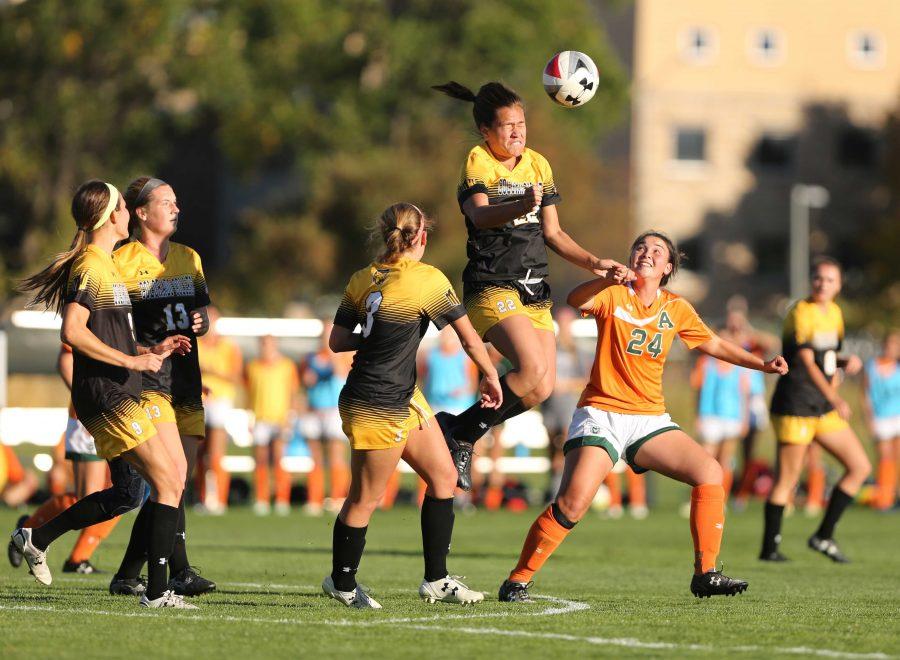 Colorado State University's Mikaila Arao (24) is surrounded by Colorado College players as she watches Colorado College's Pelemarie Buika (22) head the ball during the second half of the game on Friday afternoon at the Lagoon Field. The Rams were beat by the Tigers 2-0. (Forrest Czarnecki | Collegian)