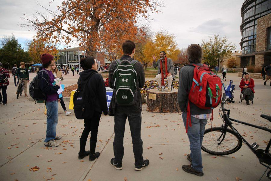 Jed Smock, on stump, preaches to students and speaks out about social and political issues in the Plaza on Tuesday afternoon. Some students became engaged and argued back at forth with Smock on viewpoints surrounding the election, race, abortion, and religion. (Forrest Czarnecki | Collegian)