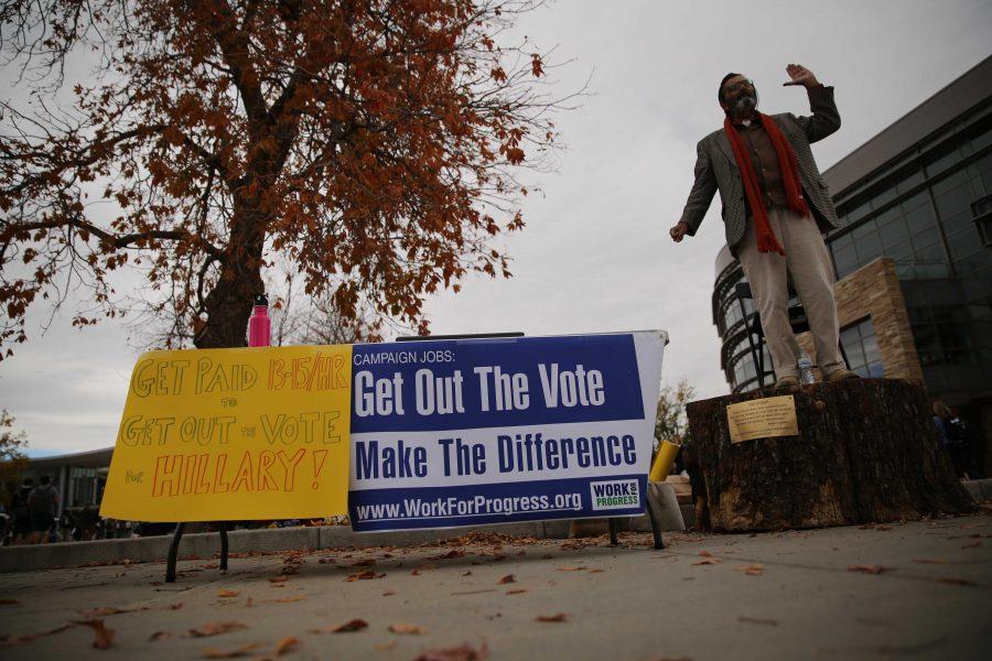 Jed Smock, on stump, preaches to students and speaks out about social and political issues in the Plaza on Tuesday afternoon. Some students became engaged and argued back at forth with Smock on viewpoints surrounding the election, race, abortion, and religion. (Forrest Czarnecki | Collegian)