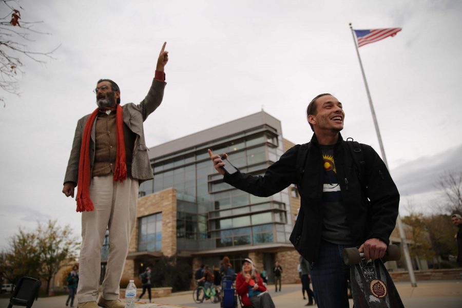 Colorado State University student Heath Elliott, right, and Jed Smock, left, get into an animated argument about this year's presidential nominees while in the Plaza on Tuesday afternoon. Elliott and Smock argued back at forth on viewpoints surrounding the election, race, sexuality, and religion. (Forrest Czarnecki | Collegian)