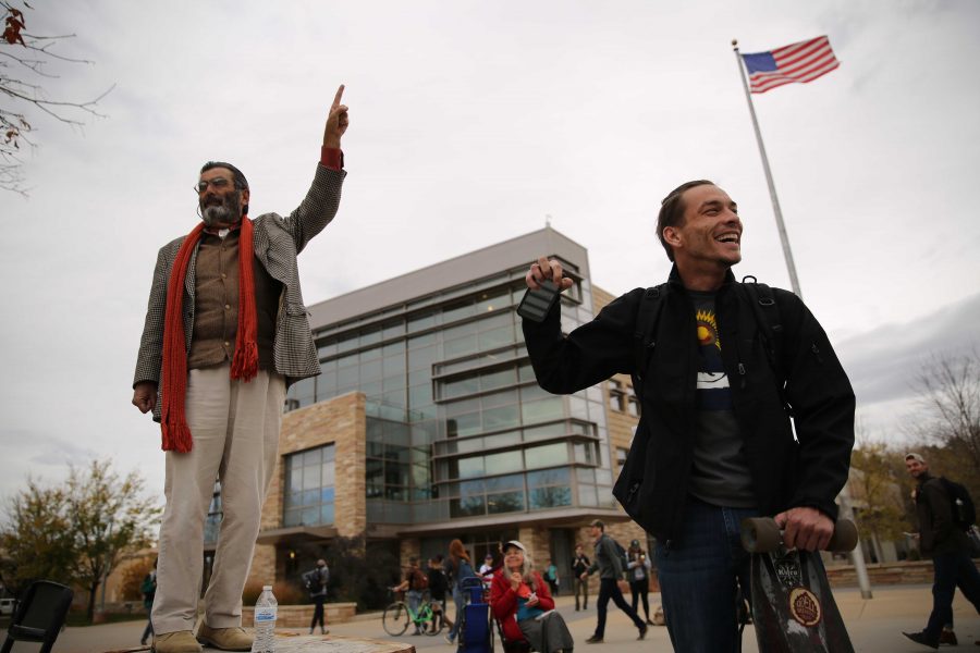Colorado State University student Heath Elliott, right, and Jed Smock, left, get into an animated argument about this year's presidential nominees while in the Plaza on Tuesday afternoon. Elliott and Smock argued back at forth on viewpoints surrounding the election, race, sexuality, and religion. (Forrest Czarnecki | Collegian)