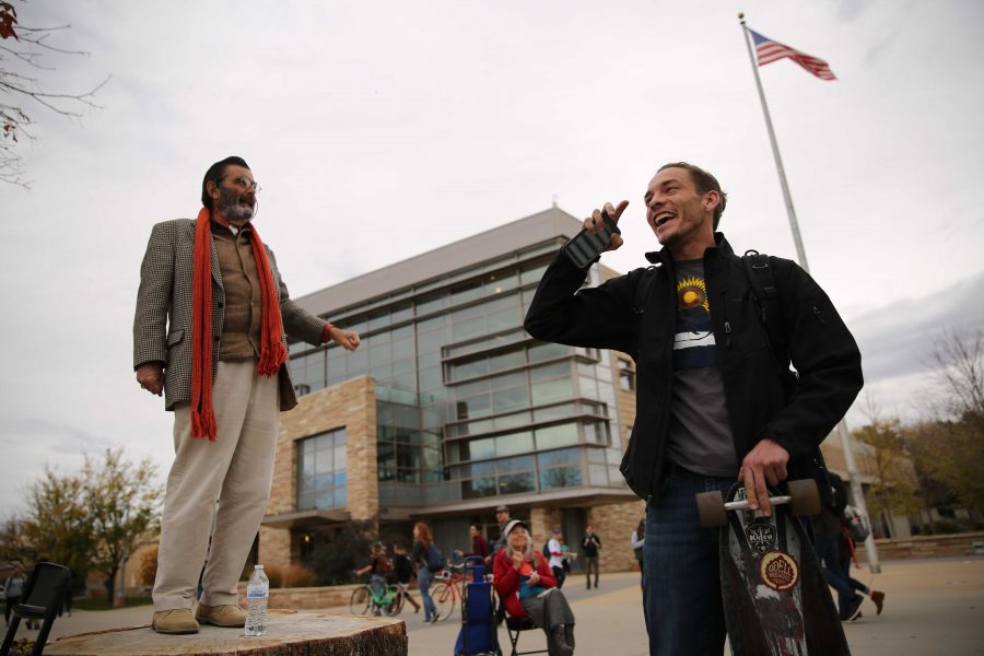 Colorado State University student Heath Elliott, right, and Jed Smock, left, get into an animated argument about this year's presidential nominees while in the Plaza on Tuesday afternoon. Elliott and Smock argued back at forth on viewpoints surrounding the election, race, sexuality, and religion. (Forrest Czarnecki | Collegian)