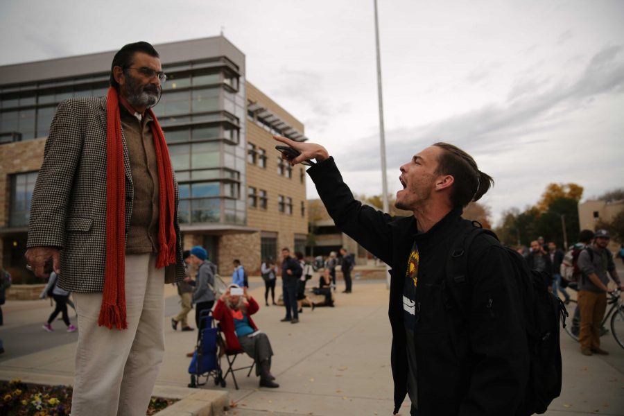 Colorado State University student Heath Elliott, right, and Jed Smock, left, get into an animated argument about this year's presidential nominees while in the Plaza on Tuesday afternoon. Elliott and Smock argued back at forth on viewpoints surrounding the election, race, sexuality, and religion. (Forrest Czarnecki | Collegian)