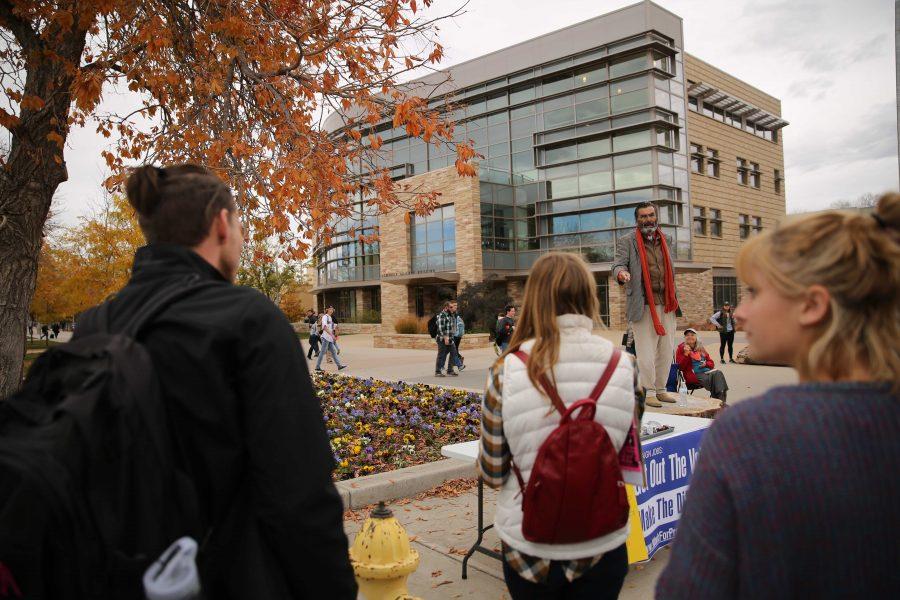 Jed Smock, on stump, preaches to students and speaks out about social and political issues in the Plaza on Tuesday afternoon. Some students became engaged and argued back at forth with Smock on viewpoints surrounding the election, race, abortion, and religion. (Forrest Czarnecki | Collegian)