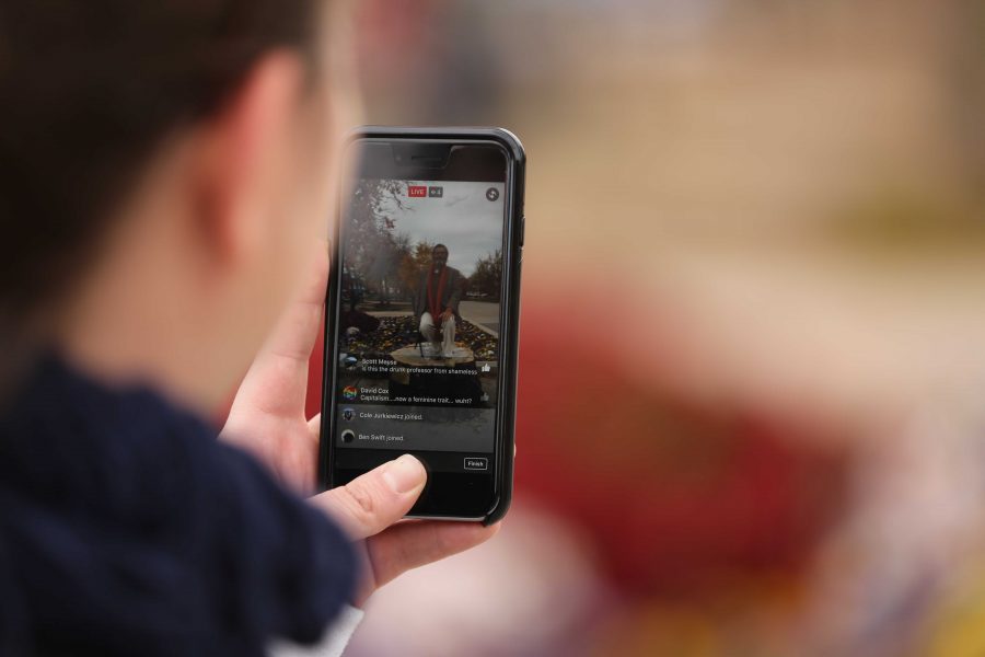 A Colorado State University student records a social and political speech by Jed Smock in the Plaza on Tuesday afternoon. Smock  argued back at forth with students on viewpoints surrounding the election, race, sexuality, and religion. (Forrest Czarnecki | Collegian)