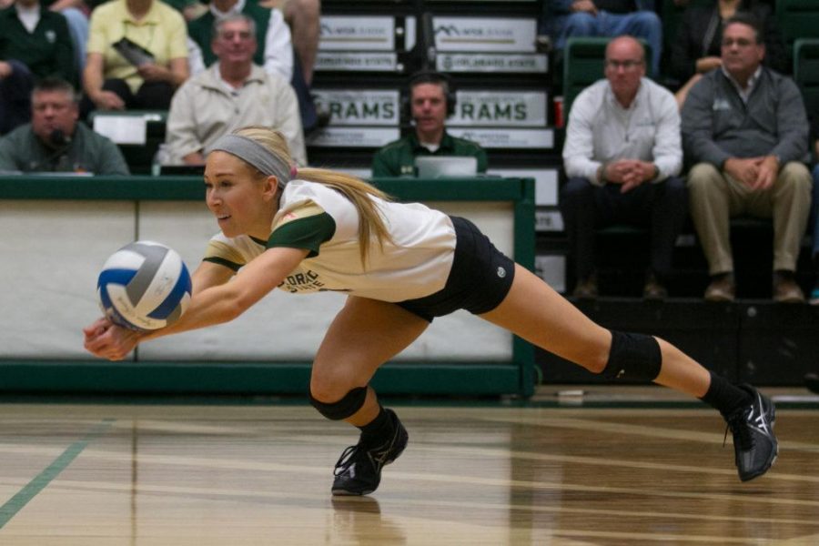 Junior McKenna Thornlow dives for a ball during the third set of play against Nevada. CSU defeated Nevada in three sets of play. (Elliott Jerge | Collegian)