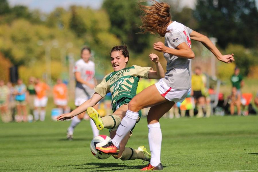 CSU Senior Amy Eckert goes for a tackle against a UNLV player in the second half of action. (Elliott Jerge | Collegian)