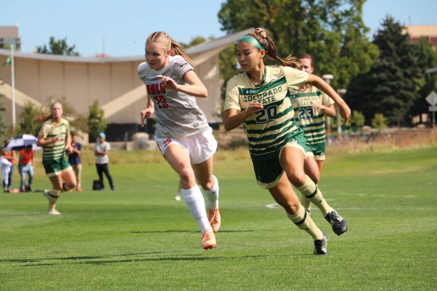 Janelle Stone (20) races UNLV to the ball. 

Author: Riley de Ryk