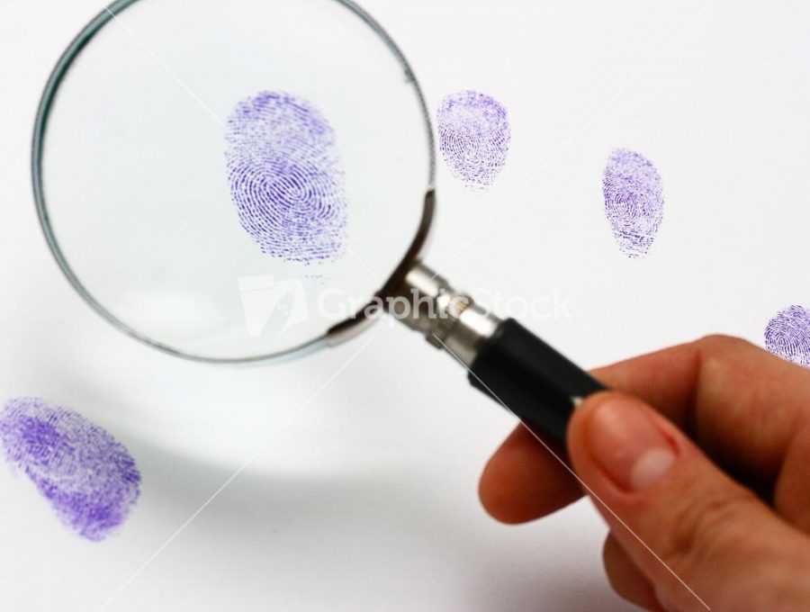 Police Examine A Fingerprint Left By A Suspect Photo courtesy of graphicstock.com