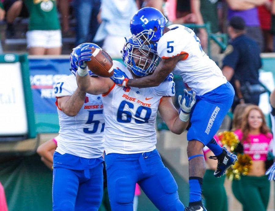 Boise State lineman Tyler Horn, center, celebrates with teammates after recovering a fumble during the Broncos 41-10 win at CSU last season. (Abbie Parr/Collegian)