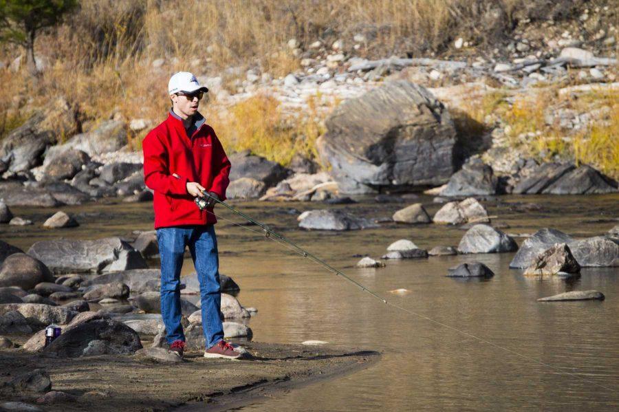 Brody Bean, a Fort Collins native, spends his weekend fishing up the Poudre Canyon at one of his favorite spots. He claimed these weekends have been warmer than usual, so why not take advantage of it? (Michael Berg | Collegian)