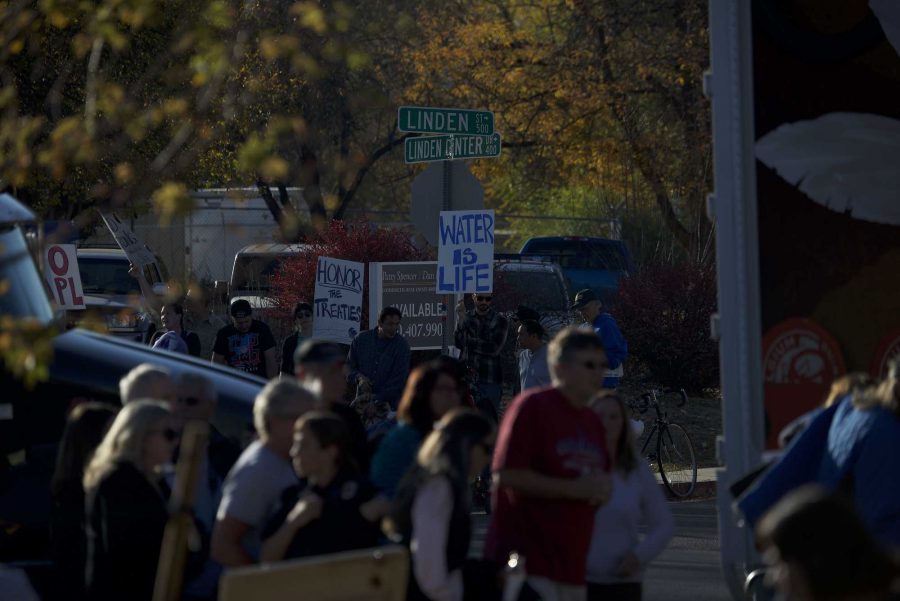 Dakota Access Pipeline protesters on the corner of Linden and Linden Center in Fort Collins before Bill Clinton spoke at New Belgium on Nov 4, 2016. (Luke Walker | Collegian)