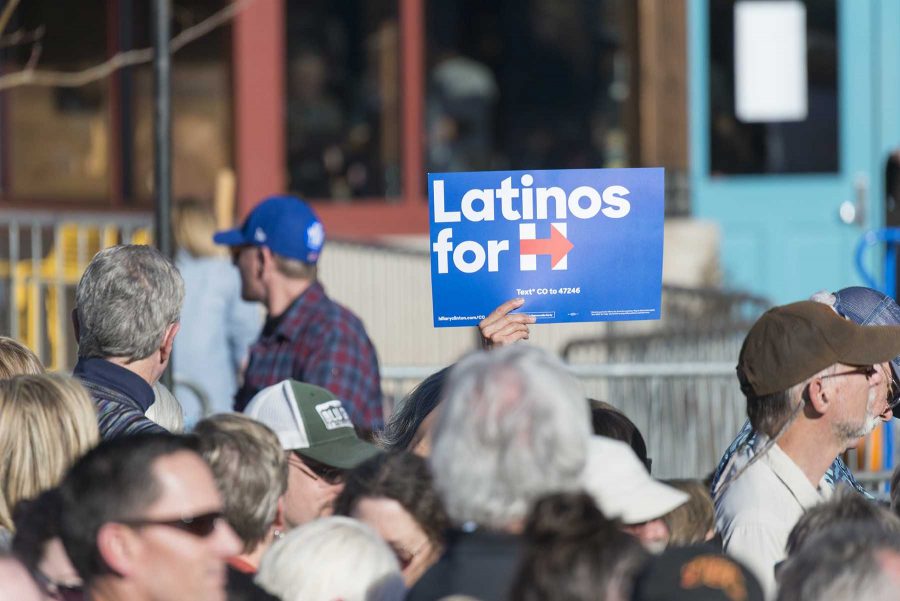 A fan holds up Latinos for Hilary sign before Bill Clinton speaks at New Belgium on Nov 4, 2016. (Luke Walker | Collegian)