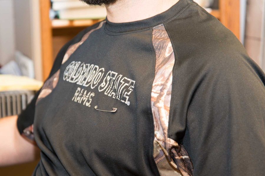 Steve Johnson a graduate student in mechanical engineering wears a pin on his shirt because the university is a safe place and nobody should deal with fear or intimidation. (Luke Walker | Collegian)