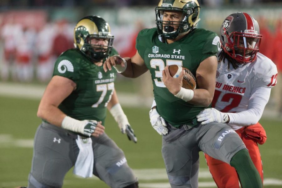 Colorado State University running back Izzy Matthews (35) carries the ball for a touchdown against New Mexico at Hughes Stadium on Nov 19. This is the final game at Hughes Stadium before the opening of an on campus stadium on 2017. (Luke Walker | Collegian)