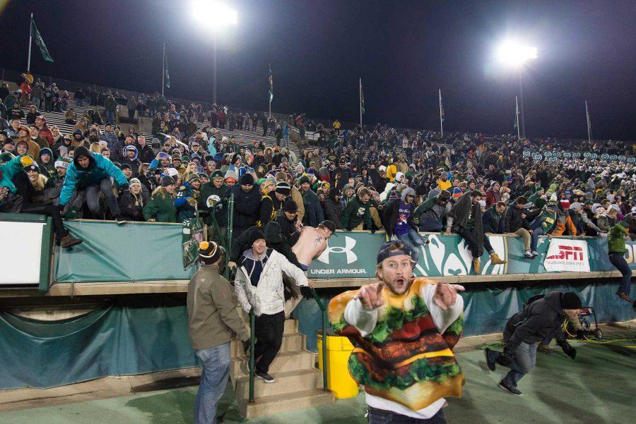 Fans rush the field at the end of the game against New Mexico at Hughes Stadium on Nov 19. This is the final game that will be played at Hughes Stadium before the opening of an on campus stadium in 2017. (Luke Walker | Collegian)