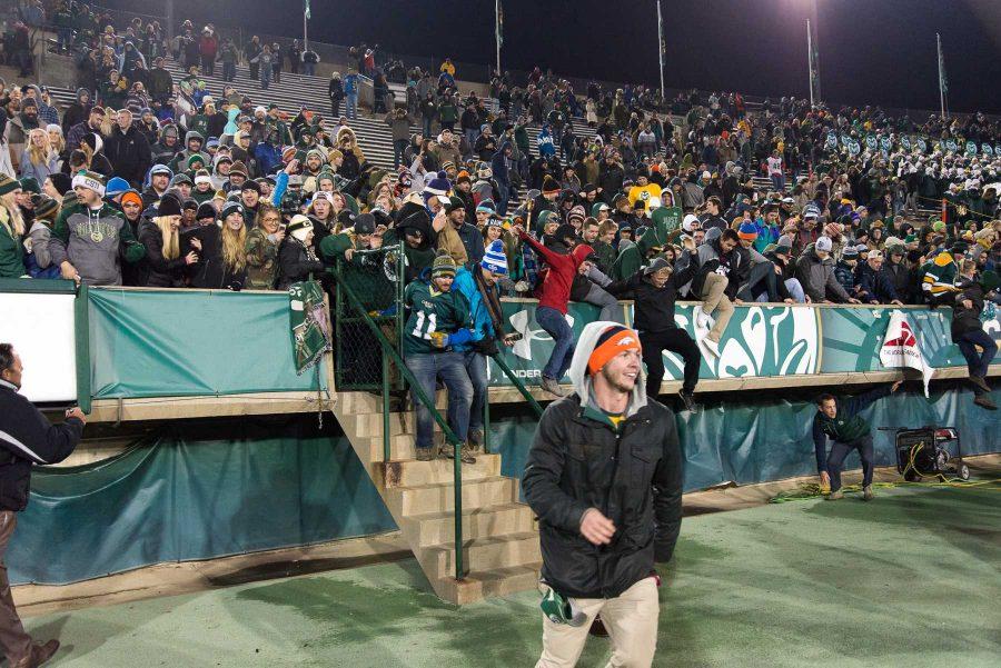 Fans rush the field at the end of the game against New Mexico at Hughes Stadium on Nov 19. This is the final game that will be played at Hughes Stadium before the opening of an on campus stadium in 2017. (Luke Walker | Collegian)