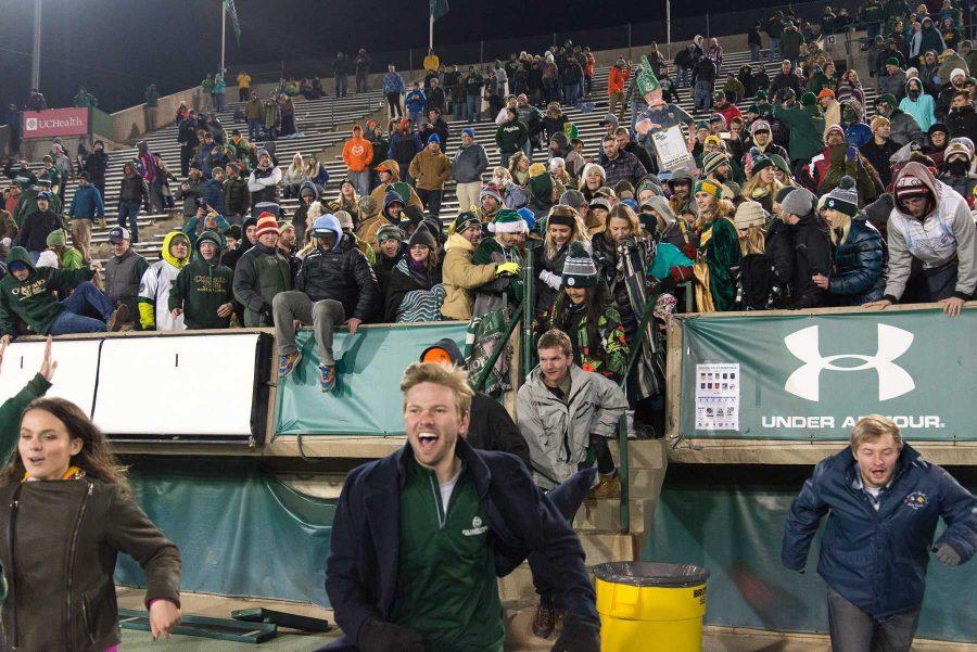 Fans rush the field at the end of the game against New Mexico at Hughes Stadium on Nov 19. This is the final game that will be played at Hughes Stadium before the opening of an on campus stadium in 2017. (Luke Walker | Collegian)