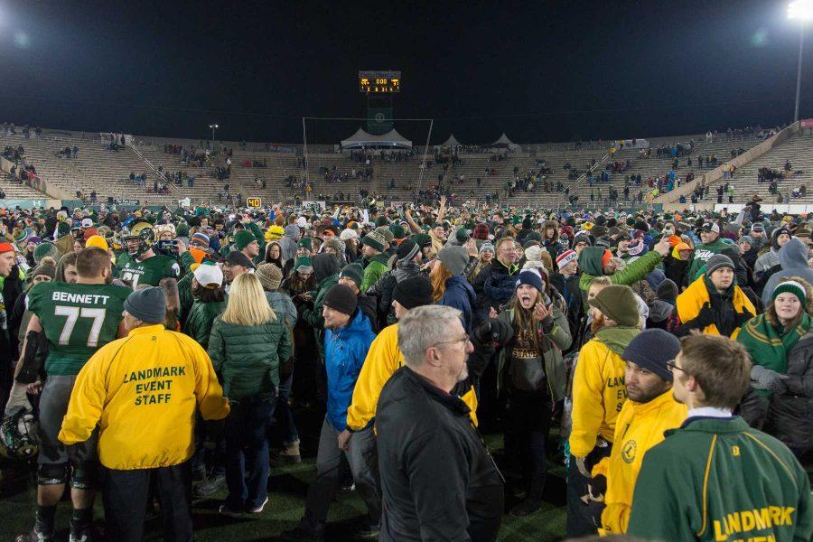 Fans rush the field at the end of the game against New Mexico at Hughes Stadium on Nov 19. This is the final game that will be played at Hughes Stadium before the opening of an on campus stadium in 2017. (Luke Walker | Collegian)