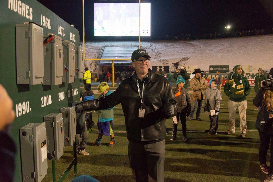 Athletic Director Joe Parker flips off one of the lights at Hughes Stadium off at the end of the game against New Mexico. This is the last game that will be played at Hughes Stadium before the opening of an on campus stadium in 2017. (Luke Walker | Collegian)