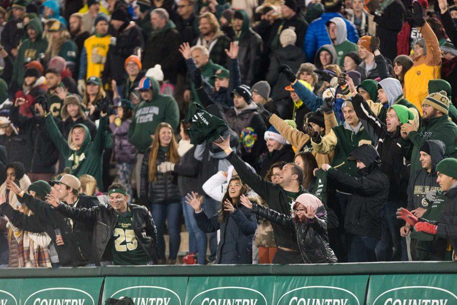 Colorado State University students and fans attempt to catch a teeshirt that is shot into the stands at Hughes Stadium on Nov 19. The is the final game at Hughes Stadium before the opening of an on campus stadium in 2017. (Luke Walker | Collegian)