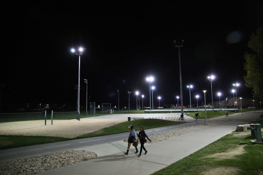 A couple of Colorado State University students walk past the Intramural Sports fields on Monday, October 31st. (Forrest Czarnecki | Collegian)