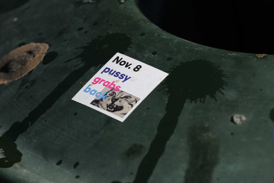A political sticker is seen on the side of a garbage can in the plaza during the week prior to the election. (Forrest Czarnecki | Collegian)