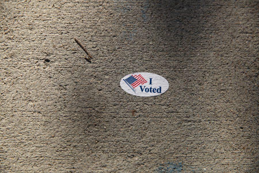 An "I Voted" sticker is stuck to the sidewalk in the Plaza during the week prior to the election. (Forrest Czarnecki | Collegian)