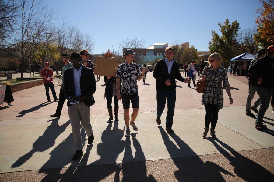 Democratic U.S. Senator Michael Bennet, second from right, talks to reporters and members of the press while in the Plaza on Thursday, November 3rd. Bennet made an appearance at Colorado State University and spoke about his campaign just a week prior to the election. (Forrest Czarnecki | Collegian)