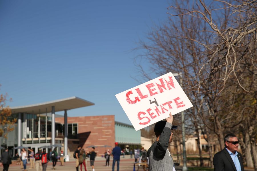Supporters of Republican candidate for the U.S. Senate Darryl Glenn hold signs for Glenn during a rally in the Plaza on Friday, November 4th. (Forrest Czarnecki | Collegian)