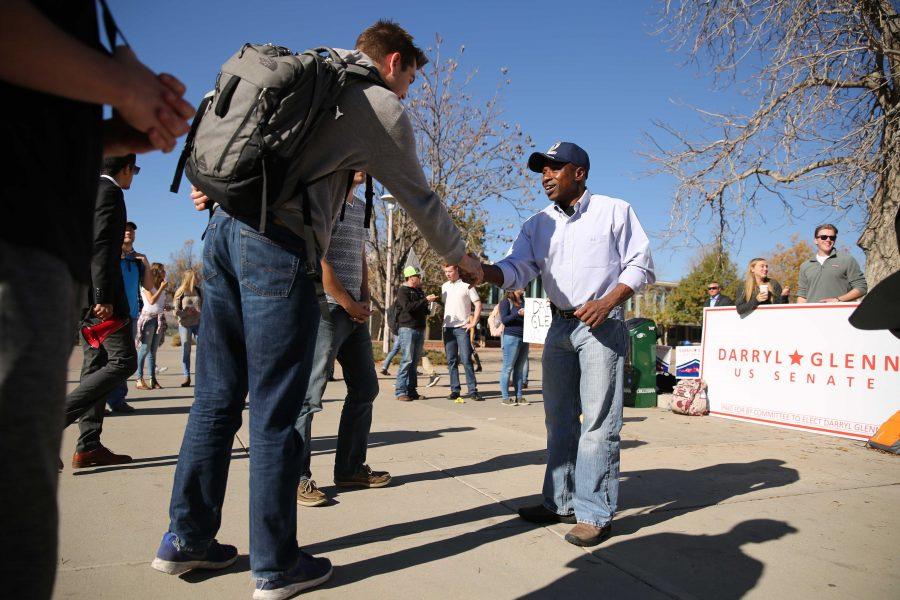 Republican candidate for the U.S. Senate Darryl Glenn shakes the hand of a constituent of his in the Plaza on Friday, November 4th. (Forrest Czarnecki | Collegian)
