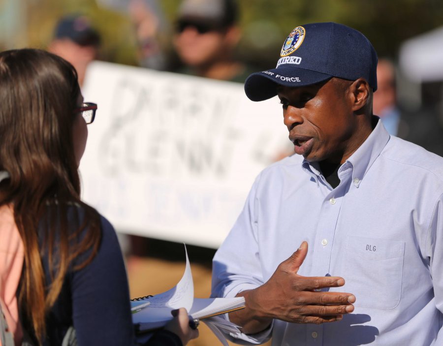 Republican candidate for the U.S. Senate Darryl Glenn speaks to a member of the press at his rally in the Plaza on Friday, November 4th. (Forrest Czarnecki | Collegian)