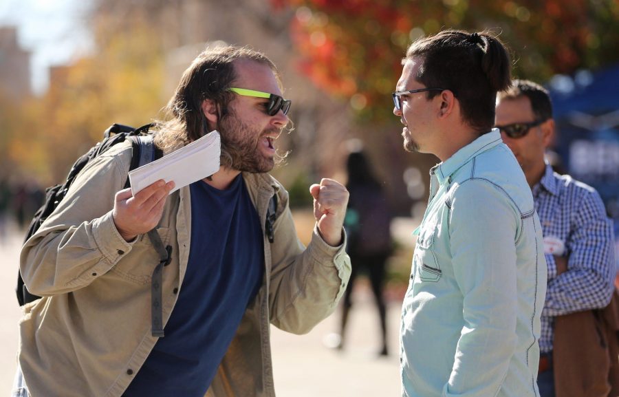 Joe Sancaniello, right, talks with a protestor during a rally for Republican candidate for the U.S. Senate, Darryl Glenn, in the Plaza on Nov. 4, 2016. (Forrest Czarnecki | Collegian)