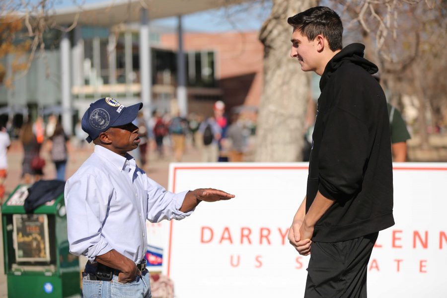 Colorado State University student Chris Illig, right, meets with Republican candidate for the U.S. Senate, Darryl Glenn, in the Plaza on Friday, November 4. (Forrest Czarnecki | Collegian)