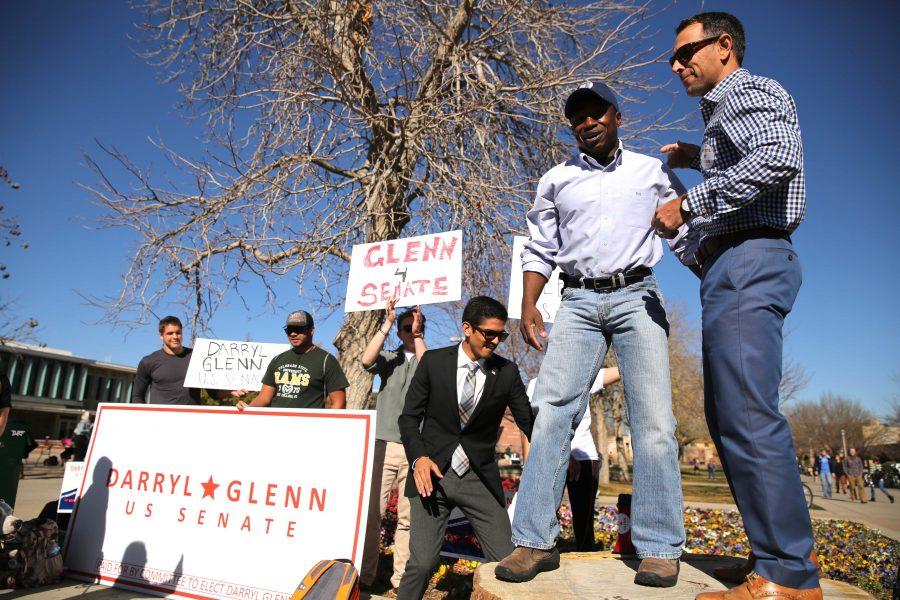 Republican candidate for the U.S. Senate, Darryl Glenn (in blue shirt with hat), is introduced before speaking in the Plaza on Friday, November 4. (Forrest Czarnecki | Collegian)