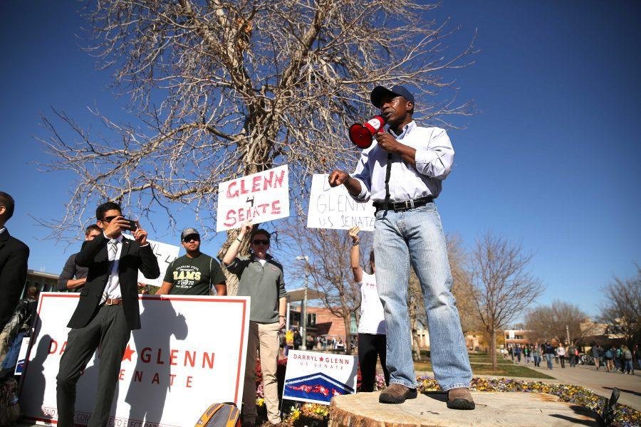 Republican candidate for the U.S. Senate, Darryl Glenn (in blue shirt with hat), speaks in the Plaza on Friday, November 4. (Forrest Czarnecki | Collegian)