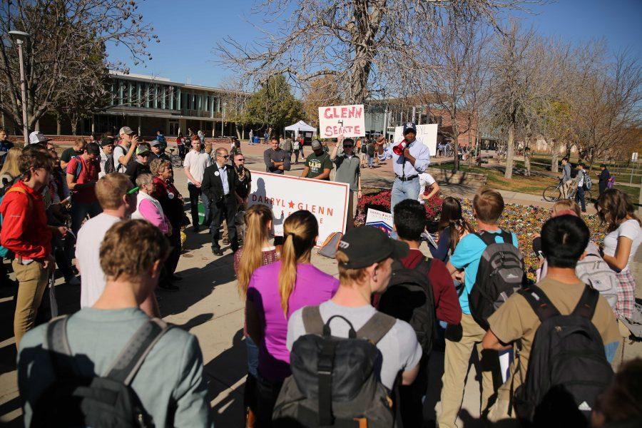 Republican candidate for the U.S. Senate, Darryl Glenn (in blue shirt with hat), speaks in the Plaza on Friday, November 4th. (Forrest Czarnecki | Collegian)