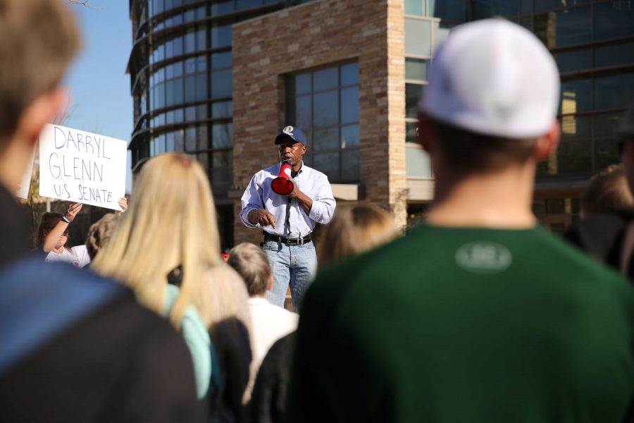 Republican candidate for the U.S. Senate, Darryl Glenn (in blue shirt with hat), speaks in the Plaza on Friday, November 4th. (Forrest Czarnecki | Collegian)