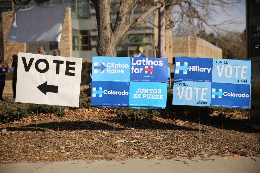 Political signs and a directional voting sign are seen in the Plaza on Tuesday, November 8th. (Forrest Czarnecki | Collegian)